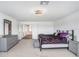 Main bedroom featuring neutral colors, furniture and ensuite bathroom at 10901 Sundrift Dr, Tampa, FL 33647