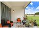 Cozy patio space features outdoor seating, a fire pit, and views of the backyard at 10901 Sundrift Dr, Tampa, FL 33647