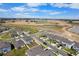 Aerial view showcases a new residential construction with community ponds and streets at 11079 Linden Depot Rd, San Antonio, FL 33576