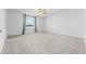 Bright bedroom with carpet, ceiling fan, and large window view at 11079 Linden Depot Rd, San Antonio, FL 33576
