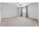 Spacious bedroom featuring plush carpeting and a ceiling fan at 11079 Linden Depot Rd, San Antonio, FL 33576