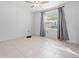 A quiet bedroom with natural light from a window at 11079 Linden Depot Rd, San Antonio, FL 33576