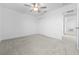 Spacious bedroom with plush carpeting, double-door closet, and neutral color scheme at 11079 Linden Depot Rd, San Antonio, FL 33576