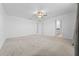 Bright and spacious bedroom with neutral carpet, a ceiling fan, and access to the bathroom at 11079 Linden Depot Rd, San Antonio, FL 33576