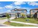 Two-story home with a well-manicured lawn, tidy flower beds, and a two-car garage at 11079 Linden Depot Rd, San Antonio, FL 33576