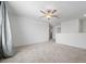 Carpeted loft area with ceiling fan, and neutral color palette at 11079 Linden Depot Rd, San Antonio, FL 33576