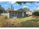 Backyard featuring a lush lawn, patio, and lush landscaping, enhancing privacy and outdoor living at 11104 Hackney Dr, Riverview, FL 33578