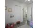 Bright bedroom features a white closet and a view to the bathroom, creating a cozy and functional space at 11104 Hackney Dr, Riverview, FL 33578
