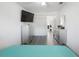 Bedroom with luxury vinyl floors, flat screen tv, and white closets at 11104 Hackney Dr, Riverview, FL 33578