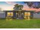 Charming single-story home with a well-maintained lawn and front porch at 11104 Hackney Dr, Riverview, FL 33578