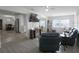 Open-concept living space with views into the adjacent dining area and kitchen at 11104 Hackney Dr, Riverview, FL 33578