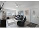 Bright living room featuring comfortable seating, a ceiling fan, and natural light at 11104 Hackney Dr, Riverview, FL 33578