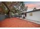 Lush backyard provides a private oasis with a covered patio, perfect for relaxation and enjoyment at 11747 104Th N St, Largo, FL 33773