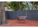 Enjoy the outdoors with a charming wooden swing nestled under a shady tree in the serene backyard at 11747 104Th N St, Largo, FL 33773