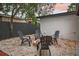 Relax and unwind in the backyard oasis, complete with a cozy fire pit area surrounded by comfortable seating at 11747 104Th N St, Largo, FL 33773