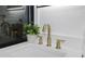 Bathroom vanity featuring modern brass hardware and a smart mirror at 11747 104Th N St, Largo, FL 33773