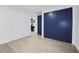 Bedroom features sliding closet doors and an adjacent ensuite bathroom with blue vanity at 11747 104Th N St, Largo, FL 33773