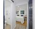 View of a bright bedroom with ensuite bathroom featuring modern decor and a white bed at 11747 104Th N St, Largo, FL 33773