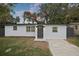 Charming single-story home featuring a freshly painted exterior, updated windows, and a well-manicured front yard at 11747 104Th N St, Largo, FL 33773