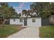 Charming single-story home featuring a freshly painted exterior, updated windows, and a well-manicured front yard at 11747 104Th N St, Largo, FL 33773