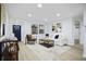 Bright living room featuring a large window and modern decor, creating a welcoming atmosphere at 11747 104Th N St, Largo, FL 33773