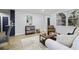 Open living space with wood floors, enhanced by natural light and stylish, comfortable furnishings at 11747 104Th N St, Largo, FL 33773