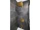 Shower with large square rainfall showerhead and stone-patterned tiles and brass fixtures at 11747 104Th N St, Largo, FL 33773