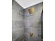 Shower with a large square rainfall showerhead and stone-patterned tiles at 11747 104Th N St, Largo, FL 33773