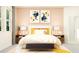 Serene bedroom featuring a plush bed with decorative pillows and a stylish bench, enhanced by soft natural light at 11841 Sparkling Topaz Cv, Parrish, FL 34219