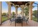 Spacious balcony featuring beautiful archways and lake view with wrought iron dining set at 11865 Fort King Hwy, Thonotosassa, FL 33592