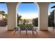 Balcony view of the lake framed by an arched portico with outdoor seating at 11865 Fort King Hwy, Thonotosassa, FL 33592