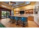 Entertain in style with a built-in bar, stone accents, and seating overlooking the outdoors at 11865 Fort King Hwy, Thonotosassa, FL 33592