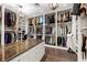 Walk-in closet with custom shelving and ample hanging space, complete with a large center island for storage at 11865 Fort King Hwy, Thonotosassa, FL 33592