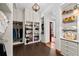 Spacious walk-in closet with custom shelving and drawers, offering plenty of storage for accessories and apparel at 11865 Fort King Hwy, Thonotosassa, FL 33592