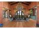 Elegant dining room with a large table, chandelier, and views of the property at 11865 Fort King Hwy, Thonotosassa, FL 33592
