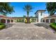 Circular brick driveway leads to garages and a center garden at 11865 Fort King Hwy, Thonotosassa, FL 33592