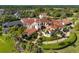 Expansive estate home with a red tile roof, sprawling lawns and mature trees at 11865 Fort King Hwy, Thonotosassa, FL 33592