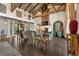 Elegant living room boasts a fireplace, beamed ceilings, and refined furnishings at 11865 Fort King Hwy, Thonotosassa, FL 33592