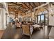 Spacious living room with beamed ceilings, exquisite decor, and views to the outside at 11865 Fort King Hwy, Thonotosassa, FL 33592