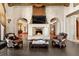 Cozy living room featuring a fireplace, TV, and comfortable seating at 11865 Fort King Hwy, Thonotosassa, FL 33592