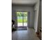 Patio with a dog, overlooking a fenced yard and a small garden at 12537 Timber Moss Ln, Riverview, FL 33579