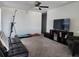 Bonus room with cozy seating, a ceiling fan, and natural light streaming through the window at 12537 Timber Moss Ln, Riverview, FL 33579