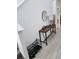 This entryway features light tile floors with a console table, lamp, and decor at 12537 Timber Moss Ln, Riverview, FL 33579