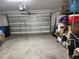Spacious garage with ample storage, a modern garage door, and organized shelving for tools and supplies at 12537 Timber Moss Ln, Riverview, FL 33579