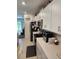 Well-lit kitchen with white cabinets, modern appliances, and stylish tile flooring at 12537 Timber Moss Ln, Riverview, FL 33579