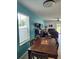 Open floor plan with a dining room leading into a living room with ample seating and a sliding glass door at 12537 Timber Moss Ln, Riverview, FL 33579