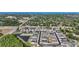Aerial shot featuring a well-planned community, showcasing uniform housing with ponds, greenery, and access roads at 1432 Gopher Loop, Tarpon Springs, FL 34689