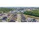 An aerial view of a charming neighborhood nestled by a tranquil lake at 1432 Gopher Loop, Tarpon Springs, FL 34689