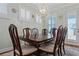 Elegant dining room with sophisticated lighting, perfect for hosting dinner parties and Gathering gatherings at 1432 Gopher Loop, Tarpon Springs, FL 34689