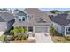 Charming two-story home with a well-manicured lawn and a two-car garage, perfect for suburban living at 1432 Gopher Loop, Tarpon Springs, FL 34689